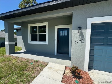 Discover this stunning, brand-new home in Citrus Springs on Citrus Springs Country Club in Florida - for sale on GolfHomes.com, golf home, golf lot