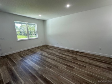 Discover this stunning, brand-new home in Citrus Springs on Citrus Springs Country Club in Florida - for sale on GolfHomes.com, golf home, golf lot