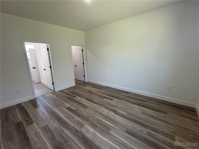 Discover this stunning, brand-new home in Citrus Springs on Citrus Springs Country Club in Florida - for sale on GolfHomes.com, golf home, golf lot