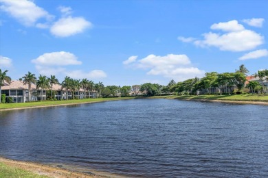 Stunning second-floor condo with breathtaking lake views! This on Boca Delray Golf and Country Club in Florida - for sale on GolfHomes.com, golf home, golf lot