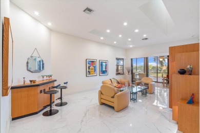 Stunning second-floor condo with breathtaking lake views! This on Boca Delray Golf and Country Club in Florida - for sale on GolfHomes.com, golf home, golf lot