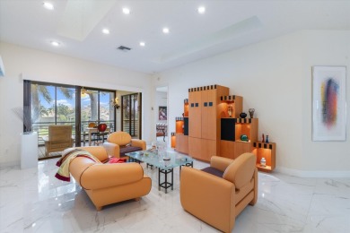 Stunning second-floor condo with breathtaking lake views! This on Boca Delray Golf and Country Club in Florida - for sale on GolfHomes.com, golf home, golf lot