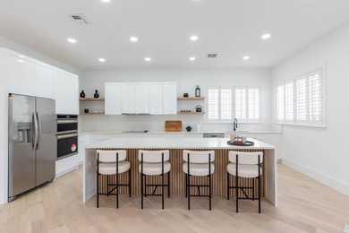 This beautifully renovated residence features new Italian wood on Palm Beach Polo and Country Club in Florida - for sale on GolfHomes.com, golf home, golf lot