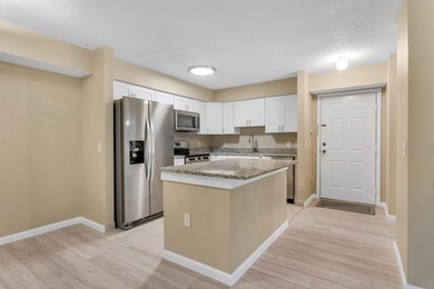 One or more photo(s) has been virtually staged. AS GOOD AS NEW! on Hunters Green Country Club in Florida - for sale on GolfHomes.com, golf home, golf lot