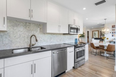 Welcome to this beautifully updated second-floor residence on Quail Ridge Golf Course and Country Club in Florida - for sale on GolfHomes.com, golf home, golf lot