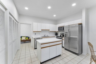 Step through the double-door entry into this stunning 2nd-floor on Boca Pointe Country Club in Florida - for sale on GolfHomes.com, golf home, golf lot