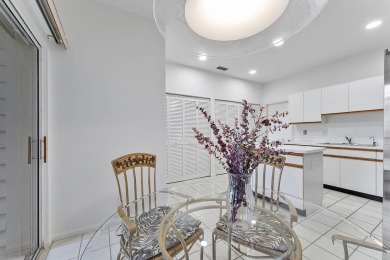 Step through the double-door entry into this stunning 2nd-floor on Boca Pointe Country Club in Florida - for sale on GolfHomes.com, golf home, golf lot