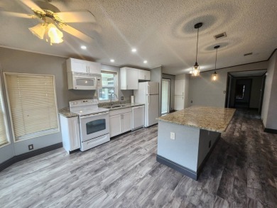 WELCOME HOME! You have found your dream retirement home in the on Golden Lakes Golf Course in Florida - for sale on GolfHomes.com, golf home, golf lot