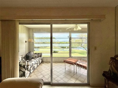 ACTIVE 55+ community! Bright 2nd floor home w/pool view. Receive on Wynmoor Golf Course in Florida - for sale on GolfHomes.com, golf home, golf lot