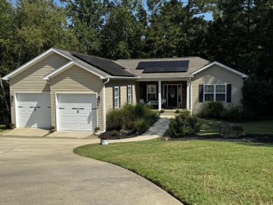 Welcome to a home where modern living and serene privacy on Monticello Golf Club At Savannah Lakes in South Carolina - for sale on GolfHomes.com, golf home, golf lot