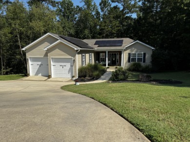 Welcome to a home where modern living and serene privacy on Monticello Golf Club At Savannah Lakes in South Carolina - for sale on GolfHomes.com, golf home, golf lot
