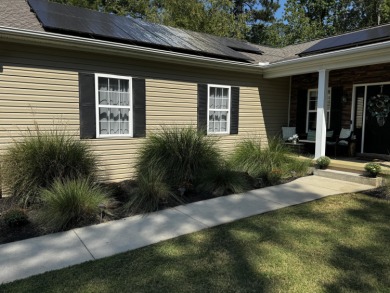 Welcome to a home where modern living and serene privacy on Monticello Golf Club At Savannah Lakes in South Carolina - for sale on GolfHomes.com, golf home, golf lot