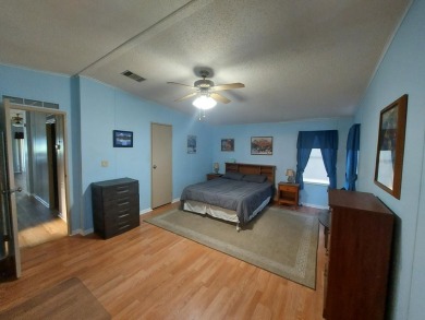 Air conditioned lanai & screened in porch are 2 ways to enjoy on Lakes at Leesburg Golf Course in Florida - for sale on GolfHomes.com, golf home, golf lot