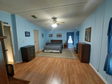 Air conditioned lanai & screened in porch are 2 ways to enjoy on Lakes at Leesburg Golf Course in Florida - for sale on GolfHomes.com, golf home, golf lot