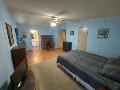 Air conditioned lanai & screened in porch are 2 ways to enjoy on Lakes at Leesburg Golf Course in Florida - for sale on GolfHomes.com, golf home, golf lot