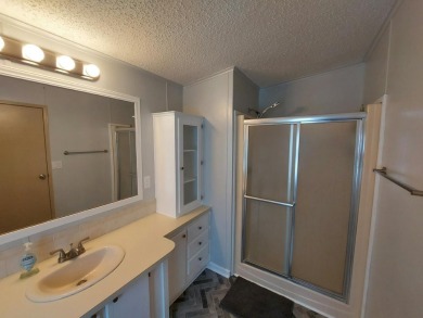 Air conditioned lanai & screened in porch are 2 ways to enjoy on Lakes at Leesburg Golf Course in Florida - for sale on GolfHomes.com, golf home, golf lot