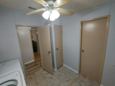 Air conditioned lanai & screened in porch are 2 ways to enjoy on Lakes at Leesburg Golf Course in Florida - for sale on GolfHomes.com, golf home, golf lot