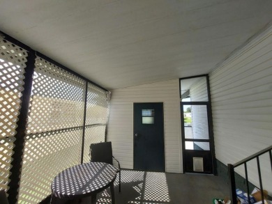 Air conditioned lanai & screened in porch are 2 ways to enjoy on Lakes at Leesburg Golf Course in Florida - for sale on GolfHomes.com, golf home, golf lot