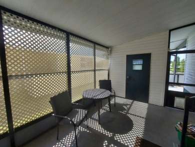 Air conditioned lanai & screened in porch are 2 ways to enjoy on Lakes at Leesburg Golf Course in Florida - for sale on GolfHomes.com, golf home, golf lot
