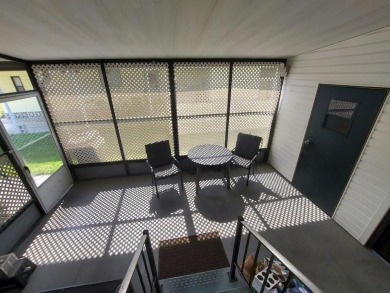 Air conditioned lanai & screened in porch are 2 ways to enjoy on Lakes at Leesburg Golf Course in Florida - for sale on GolfHomes.com, golf home, golf lot