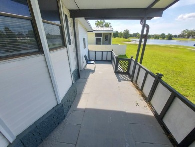 Air conditioned lanai & screened in porch are 2 ways to enjoy on Lakes at Leesburg Golf Course in Florida - for sale on GolfHomes.com, golf home, golf lot