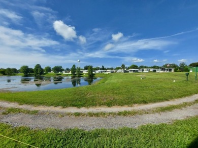 Air conditioned lanai & screened in porch are 2 ways to enjoy on Lakes at Leesburg Golf Course in Florida - for sale on GolfHomes.com, golf home, golf lot