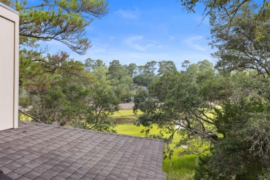 Overlooking the ever-changing tidal marsh, this charming on The Seabrook Island Club in South Carolina - for sale on GolfHomes.com, golf home, golf lot