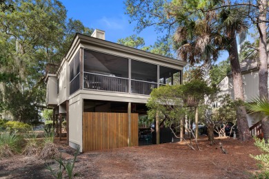 Overlooking the ever-changing tidal marsh, this charming on The Seabrook Island Club in South Carolina - for sale on GolfHomes.com, golf home, golf lot
