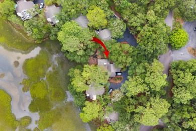 Overlooking the ever-changing tidal marsh, this charming on The Seabrook Island Club in South Carolina - for sale on GolfHomes.com, golf home, golf lot