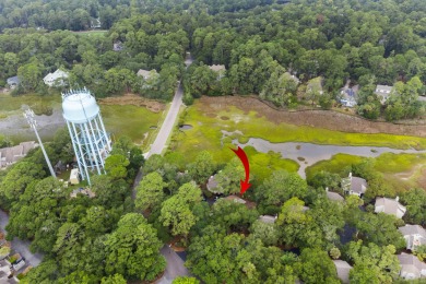 Overlooking the ever-changing tidal marsh, this charming on The Seabrook Island Club in South Carolina - for sale on GolfHomes.com, golf home, golf lot