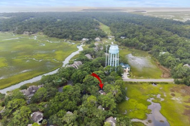 Overlooking the ever-changing tidal marsh, this charming on The Seabrook Island Club in South Carolina - for sale on GolfHomes.com, golf home, golf lot