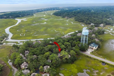 Overlooking the ever-changing tidal marsh, this charming on The Seabrook Island Club in South Carolina - for sale on GolfHomes.com, golf home, golf lot