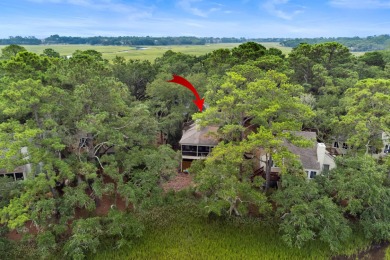 Overlooking the ever-changing tidal marsh, this charming on The Seabrook Island Club in South Carolina - for sale on GolfHomes.com, golf home, golf lot