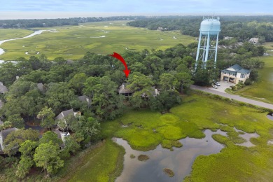 Overlooking the ever-changing tidal marsh, this charming on The Seabrook Island Club in South Carolina - for sale on GolfHomes.com, golf home, golf lot