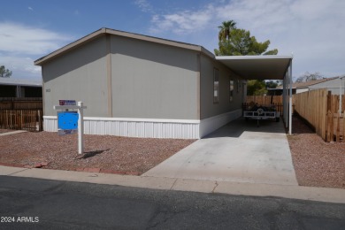 Move-in ready and spacious, this multi-wide home in Shamrock on Desert Mirage Golf Course in Arizona - for sale on GolfHomes.com, golf home, golf lot