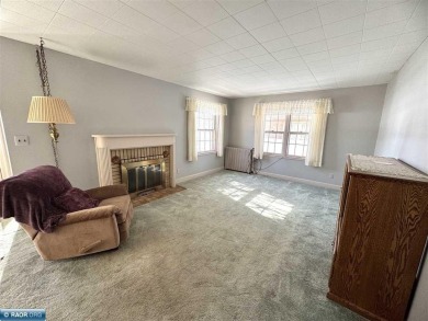 Discover this charming 3-bed, 2.75-bath gem overlooking the lush on Virginia Golf Course in Minnesota - for sale on GolfHomes.com, golf home, golf lot