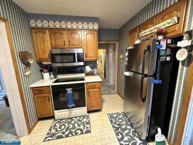 Discover this charming 3-bed, 2.75-bath gem overlooking the lush on Virginia Golf Course in Minnesota - for sale on GolfHomes.com, golf home, golf lot