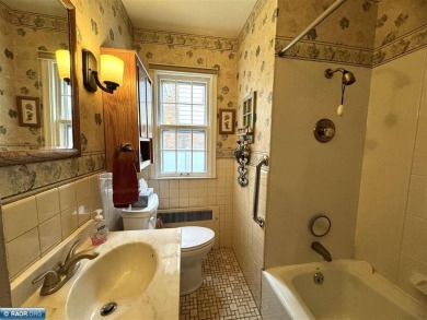 Discover this charming 3-bed, 2.75-bath gem overlooking the lush on Virginia Golf Course in Minnesota - for sale on GolfHomes.com, golf home, golf lot