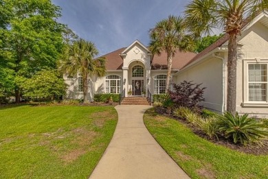 Custom built with abundant amenities...discover the epitome of on Oak Grove Island Golf and Country Club in Georgia - for sale on GolfHomes.com, golf home, golf lot