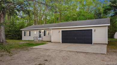 Welcome to this charming and updated ranch in the heart of on Burning Oak Country Club in Michigan - for sale on GolfHomes.com, golf home, golf lot