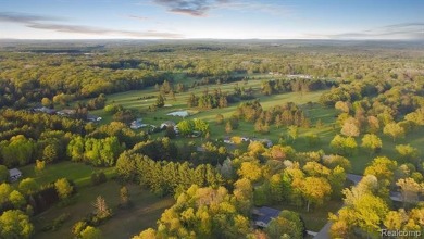 Welcome to this charming and updated ranch in the heart of on Burning Oak Country Club in Michigan - for sale on GolfHomes.com, golf home, golf lot