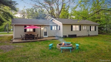 Welcome to this charming and updated ranch in the heart of on Burning Oak Country Club in Michigan - for sale on GolfHomes.com, golf home, golf lot