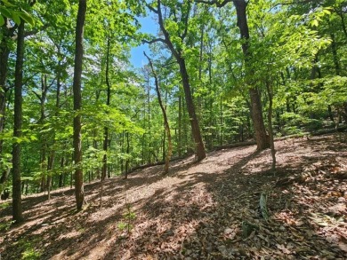 Nestled within the serene and exclusive Big Canoe community in on Big Canoe Golf Club - Cherokee in Georgia - for sale on GolfHomes.com, golf home, golf lot