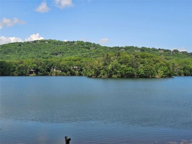 Nestled within the serene and exclusive Big Canoe community in on Big Canoe Golf Club - Cherokee in Georgia - for sale on GolfHomes.com, golf home, golf lot