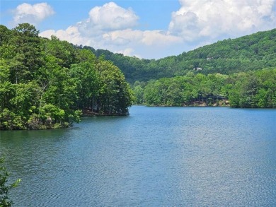 Nestled within the serene and exclusive Big Canoe community in on Big Canoe Golf Club - Cherokee in Georgia - for sale on GolfHomes.com, golf home, golf lot
