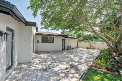 Stunning 4-bedroom, 3-full-bath oasis is nestled in the on Fort Lauderdale Country Club in Florida - for sale on GolfHomes.com, golf home, golf lot