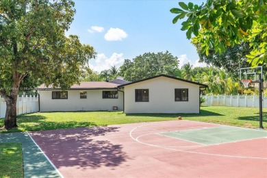 Stunning 4-bedroom, 3-full-bath oasis is nestled in the on Fort Lauderdale Country Club in Florida - for sale on GolfHomes.com, golf home, golf lot