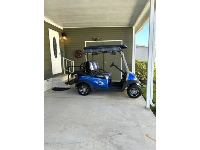 This 2-bedroom, 2-bathroom home offers a perfect place for on Lake Henry Golf Club in Florida - for sale on GolfHomes.com, golf home, golf lot