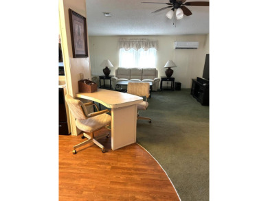 This 2-bedroom, 2-bathroom home offers a perfect place for on Lake Henry Golf Club in Florida - for sale on GolfHomes.com, golf home, golf lot