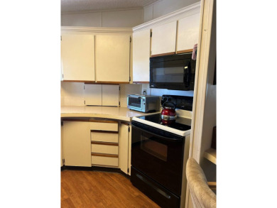 This 2-bedroom, 2-bathroom home offers a perfect place for on Lake Henry Golf Club in Florida - for sale on GolfHomes.com, golf home, golf lot